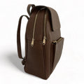 Stylish brown leather women’s backpack with laptop compartment, adjustable straps, and premium handmade design — perfect for work, travel, and everyday use.