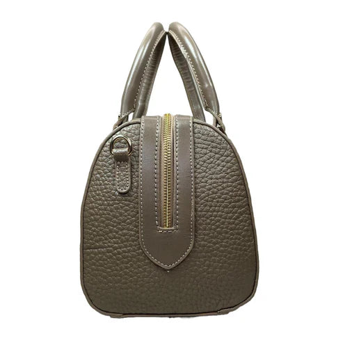 Beige genuine leather barrel shoulder bag with adjustable strap, minimalist design, and premium handcrafted finish.