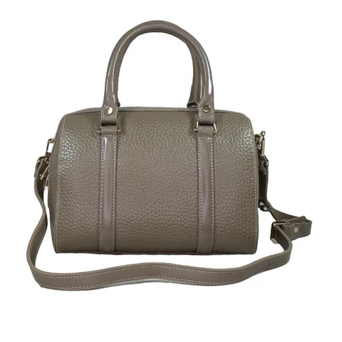 Beige genuine leather barrel shoulder bag with adjustable strap, minimalist design, and premium handcrafted finish.