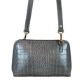 LeatherLuxe silver leather clutch and crossbody bag with detachable shoulder strap, elegant metallic finish, and minimalist luxury design for evening and casual wear.