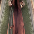 Elegant green leather office bag with detachable shoulder strap, ideal for professionals and business travel.