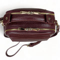 Elegant dark red genuine leather women’s satchel handbag with structured medium design and gold-tone accents — perfect for everyday and office wear.