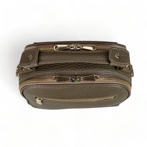 Beige leather women's handbag with shoulder strap — elegant satchel for everyday and formal occasions.