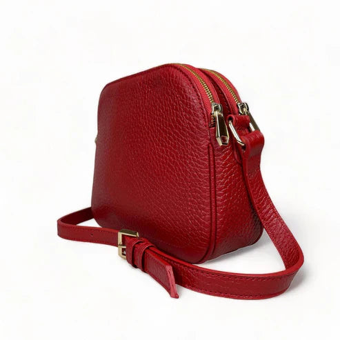 LeatherLuxe red leather women's shoulder bag with adjustable crossbody strap, elegant and stylish design for everyday fashion.