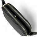 Premium black leather crossbody shoulder bag with adjustable strap, sleek minimalist design, and high-quality stitching for everyday use.