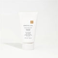 White hair product bottle with 'Kristin Ess' branding on a white background
