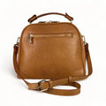 Premium leather women's handbag in satchel and shoulder bag style, featuring elegant stitching, durable handles, and a classic design for everyday and formal use.