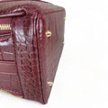 Red leather women's handbag – premium satchel and shoulder bag with elegant stitching, gold-tone hardware, and adjustable strap – luxury fashion accessory for women.