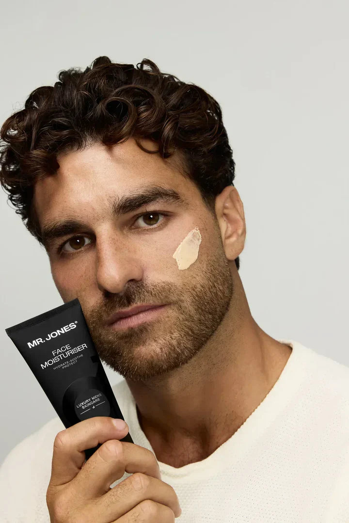 Virtue men’s skincare set with cleanser, exfoliator, moisturizer, face mask, and serum in sleek black packaging displayed with male models