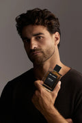 Virtue Eau De Parfum for men in sleek glass bottle with black label and cap, displayed with lifestyle shots and luxury background