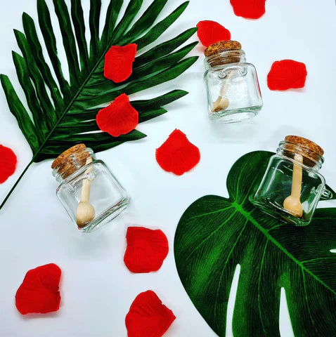 Lavvish Lavender and Rose Bath Salts in glass jar with wooden spoon and floral accents