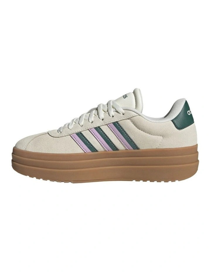 Beige Adidas sneaker with brown sole on a white background