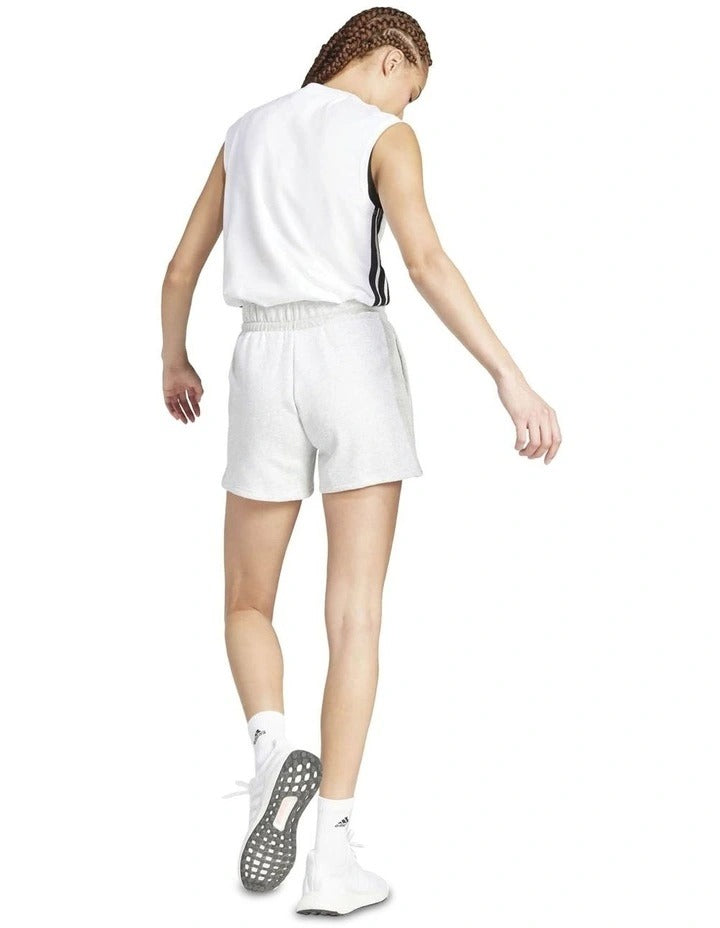 Person wearing white shorts on a white background