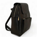 LeatherLuxe black leather women’s backpack with sleek minimalist design, adjustable shoulder straps, and gold hardware — perfect for work, travel, or everyday style.