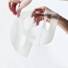 Lavvish Bio Collagen Face Mask in pink packaging displayed on vanity with soft natural lighting and skincare accessories